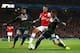 LONDON, ENGLAND - OCTOBER 01: Kieran Gibbs of Arsenal finds his routeto goal blocked by Miguel Britos (L) and Dries Mertens (R) of Napoli during UEFA Champions League Group F match between Arsenal FC and SSC Napoli at Emirates Stadium on October 1, 2013 in London, England. (Photo by Paul Gilham/Getty Images)