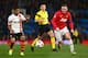 MANCHESTER, ENGLAND - DECEMBER 10: Wayne Rooney of Manchester United competes with Douglas Costa of Shakhtar Donetsk during the UEFA Champions League Group A match between Manchester United and Shakhtar Donetsk at Old Trafford on December 10, 2013 in Manchester, England. (Photo by Michael Steele/Getty Images)