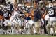 Nov 30, 2013; Auburn, AL, USA; Auburn Tigers cornerback Chris Davis (11) gets by Alabama Crimson Tide punter Cody Mandell (29) and returns a missed field goal for a 100 yard touchdown against the Alabama Crimson Tide during the fourth quarter at Jordan Hare Stadium. Auburn won 34-28. Mandatory Credit: John Reed-USA TODAY Sports