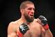 Aug 28, 2013; Indianapolis, IN, USA; Court McGee (red gloves) fights Robert Whittaker during UFC Fight Night 27 at Bankers Life Fieldhouse. Mandatory Credit: Pat Lovell-USA TODAY Sports