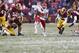 Dec 8, 2013; Landover, MD, USA; Kansas City Chiefs running back Jamaal Charles (25) carries the ball past Washington Redskins strong safety Bacarri Rambo (24) and Redskins outside linebacker Rob Jackson (50) in the third quarter at FedEx Field. The Chiefs won 45-10. Mandatory Credit: Geoff Burke-USA TODAY Sports