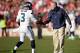 SAN FRANCISCO, CA - DECEMBER 08: Russell Wilson #3 of the Seattle Seahawks is congratulated by head coach Pete Carroll after the Seahawks offense scored a touchdown against the San Francisco 49ers during the second quarter at Candlestick Park on December 8, 2013 in San Francisco, California. (Photo by Thearon W. Henderson/Getty Images)