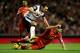 LIVERPOOL, ENGLAND - DECEMBER 4: Steven Gerrard of Liverpool looses his boot under pressure from Russell Martin of Norwich City during the Barclays Premier League match between Liverpool and Norwich City at Anfield on December 4, 2013 in Liverpool, England. (Photo by Jan Kruger/Getty Images)