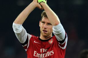 Hi-res-455184343-per-mertesacker-of-arsenal-celebrates-after-the-uefa_crop_north