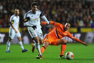Hi-res-452385027-swansea-player-alejandro-pozuelo-is-challenged-by_crop_north