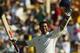 Smiles better: Tendulkar celebrates reaching his double-ton at the SCG