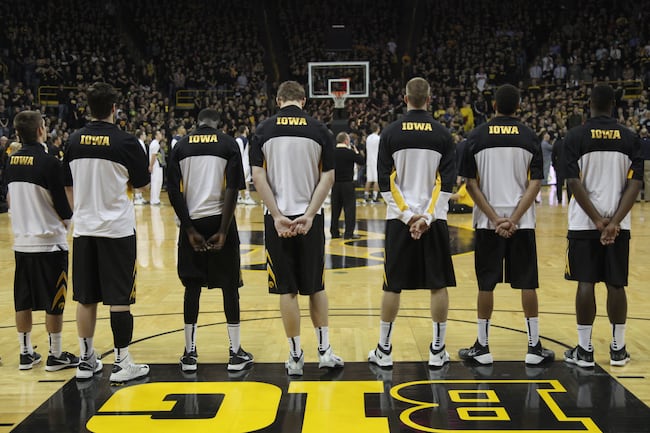 Hi-res-455030079-members-of-the-iowa-hawkeyes-line-up-before-the-start_crop_north