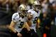 NEW ORLEANS, LA - SEPTEMBER 30: Jimmy Graham #80 celebrates with Drew Brees #9 of the New Orleans Saints after scoring a touchdown against the Miami Dolphins at the Mercedes-Benz Superdome on September 30, 2013 in New Orleans, Louisiana. (Photo by Chris Graythen/Getty Images)