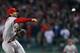 BOSTON, MA - OCTOBER 30: Matt Carpenter #13 of the St. Louis Cardinals throws to first against the Boston Red Sox during Game Six of the 2013 World Series at Fenway Park on October 30, 2013 in Boston, Massachusetts. (Photo by Rob Carr/Getty Images)