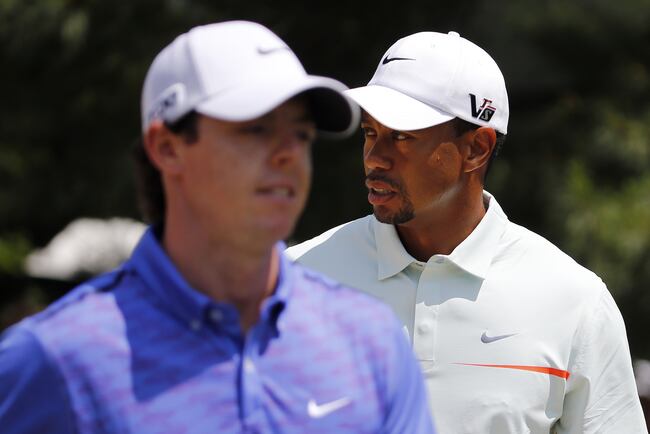 Hi-res-170612561-rory-mcilroy-of-northern-ireland-and-tiger-woods-of-the_crop_north