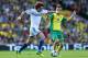 NORWICH, ENGLAND - OCTOBER 06: David Luiz of Chelsea holds off a challenge from Ricky van Wolfswinkel of Norwich City during the Barclays Premier League match between Norwich City and Chelsea at Carrow Road on October 6, 2013 in Norwich, England. (Photo by Julian Finney/Getty Images)