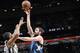 SAN ANTONIO, TX - December 13: Kevin Love #42 of the Minnesota Timberwolves shoots against the San Antonio Spurs at the AT&T Center on December 13, 2013 in San Antonio, Texas. NOTE TO USER: User expressly acknowledges and agrees that, by downloading and or using this photograph, user is consenting to the terms and conditions of the Getty Images License Agreement. Mandatory Copyright Notice: Copyright 2013 NBAE (Photos by D. Clarke Evans/NBAE via Getty Images)