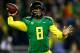 EUGENE, OR - NOVEMBER 29: Quarterback Marcus Mariota #8 of the Oregon Ducks throws a pass against the Oregon State Beavers during the 117th playing of the Civil War on November 29, 2013 at the Autzen Stadium in Eugene, Oregon. (Photo by Jonathan Ferrey/Getty Images)