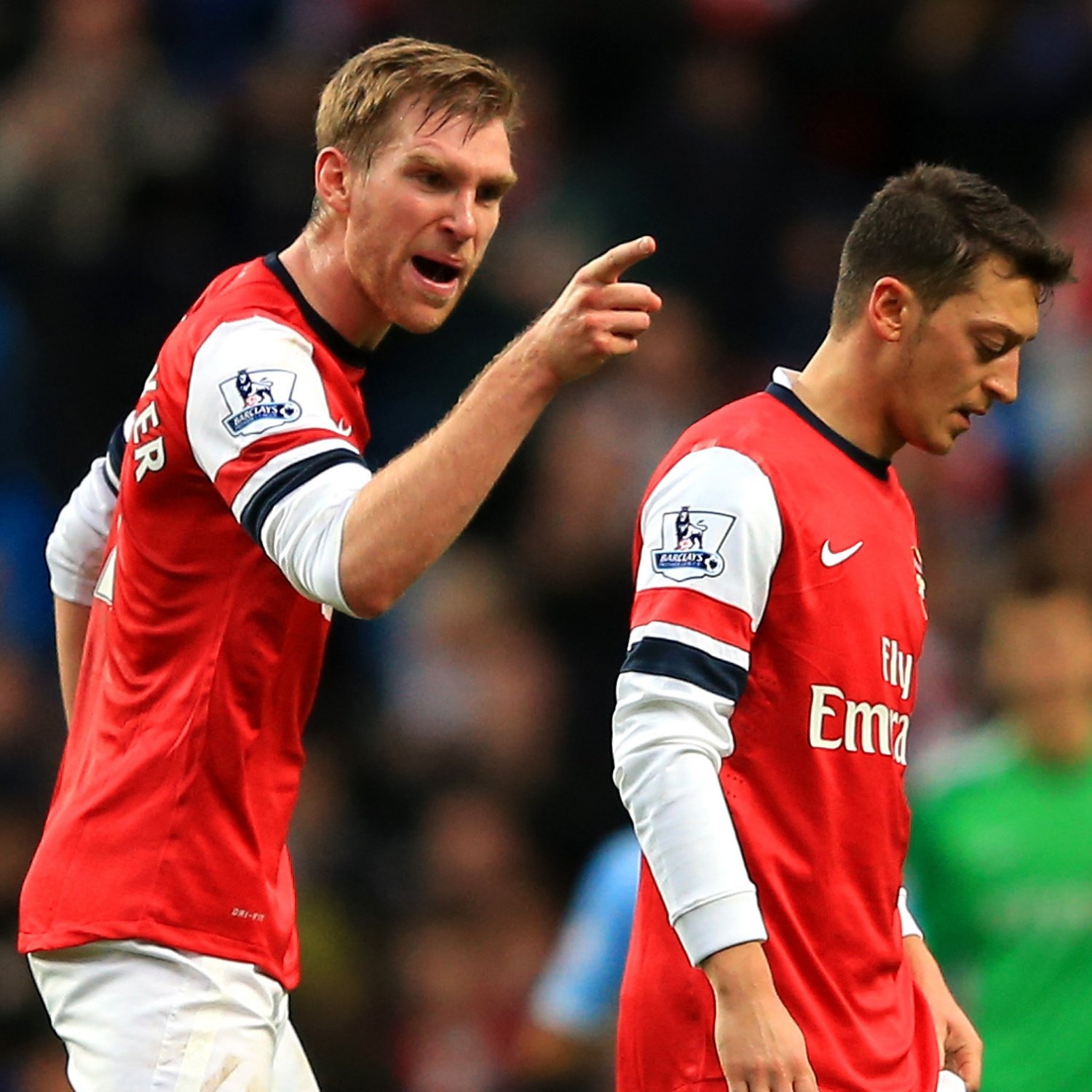 hi-res-456524873-per-mertesacker-of-arsenal-has-words-with-mesut-oezil_crop_exact.jpg