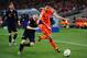 JOHANNESBURG, SOUTH AFRICA - JULY 11: Andres Iniesta of Spain is tackled by Robin Van Persie of the Netherlands during the 2010 FIFA World Cup South Africa Final match between Netherlands and Spain at Soccer City Stadium on July 11, 2010 in Johannesburg, South Africa. (Photo by Jamie McDonald/Getty Images)