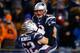FOXBORO, MA - DECEMBER 08: Tom Brady #12 celebrates with teammate Ryan Wendell #62 of the New England Patriots following a touchdown late in the fourth quarter against the Cleveland Browns during the game at Gillette Stadium on December 8, 2013 in Foxboro, Massachusetts. (Photo by Jared Wickerham/Getty Images)