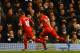 LONDON, ENGLAND - DECEMBER 15: Captain Luis Suarez of Liverpool celebrates scoring the opening goal with Philippe Coutinho of Liverpool during the Barclays Premier League match between Tottenham Hotspur and Liverpool at White Hart Lane on December 15, 2013 in London, England. (Photo by Paul Gilham/Getty Images)