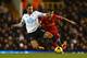 LONDON, ENGLAND - DECEMBER 15: Nacer Chadli of Tottenham Hotspur tackles Philippe Coutinho of Liverpool during the Barclays Premier League match between Tottenham Hotspur and Liverpool at White Hart Lane on December 15, 2013 in London, England. (Photo by Paul Gilham/Getty Images)