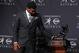 Dec 14, 2013; New York, NY, USA; Florida State Seminoles quarterback Jameis Winston looks at the trophy after being awarded the 2013 Heisman Trophy at the Marriott Marquis in New York City. Mandatory Credit: Adam Hunger-USA TODAY Sports