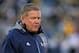 SOUTH BEND, IN - NOVEMBER 02: Head coach Brian Kelly of the Notre Dame Fighting Irish walks off of the field after checking on an injured player during a game against the Navy Midshipmen at Notre Dame Stadium on November 2, 2013 in South Bend, Indiana. Notre Dame defeated Navy 38-34. (Photo by Jonathan Daniel/Getty Images)
