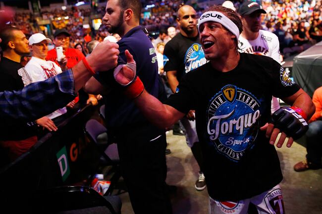 Hi-res-176717731-urijah-faber-celebrates-with-fans-following-his-win_crop_north