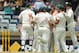 PERTH, AUSTRALIA - DECEMBER 16: Ryan Harris of Australia is congratulated by team mates after dismissing Alastair Cook of England for a golden duck during day four of the Third Ashes Test Match between Australia and England at the WACA on December 16, 2013 in Perth, Australia. (Photo by Paul Kane/Getty Images)