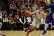 COLUMBUS, OH - DECEMBER 7: Aaron Craft #4 of the Ohio State Buckeyes drives to the hole past Brandon Peel #34 of the Central Connecticut State Blue Devils on December 7, 2013 at Value City Arena in Columbus, Ohio. Ohio State won by a final score of 74-56. (Photo by Ryan Young/Getty Images)