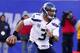 Dec 15, 2013; East Rutherford, NJ, USA; Seattle Seahawks quarterback Russell Wilson (3) is forced out of the pocket during the first half by New York Giants at MetLife Stadium. Mandatory Credit: Jim O'Connor-USA TODAY Sports
