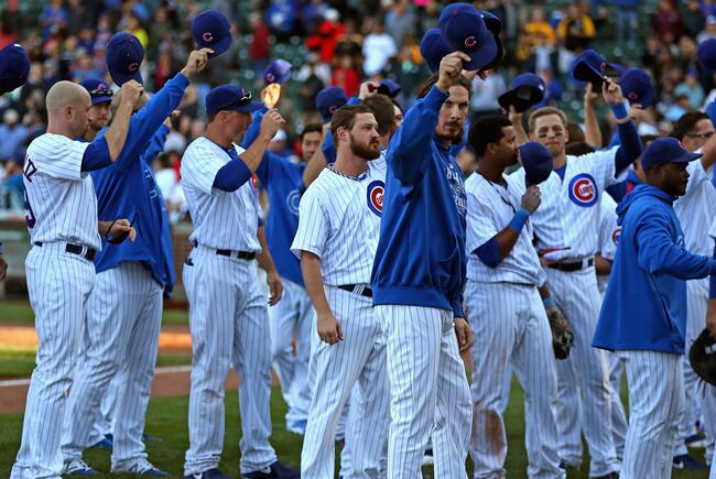 Hi-res-181809505-members-of-the-chicago-cubs-tip-their-hats-to-the-crowd_crop_north