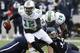 HOUSTON, TX - DECEMBER 07: Rakeem Cato #12 of the Marshall Thundering Herd scrambles out of the pocket as he gets a block from Garrett Scott #76 against the Rice Owls at Rice Stadium on December 7, 2013 in Houston, Texas. (Photo by Bob Levey/Getty Images)
