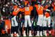 DENVER, CO - DECEMBER 8: The Denver Broncos offense huddles around Peyton Manning #18 at Sports Authority Field Field at Mile High on December 8, 2013 in Denver, Colorado. (Photo by Dustin Bradford/Getty Images)