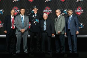 Hi-res-172010014-mirco-mueller-poses-with-the-front-office-after-being_crop_north