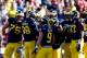 ANN ARBOR, MI - NOVEMBER 30: The Michigan Wolverines huddle against the Ohio State Buckeyes during a game at Michigan Stadium on November 30, 2013 in Ann Arbor, Michigan. (Photo by Gregory Shamus/Getty Images)