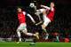 LONDON, ENGLAND - FEBRUARY 19: Laurent Koscielny of Arsenal clears the ball in front of Mario Mandzukic of Bayern Muenchen and his team-mate Thomas Vermaelen during the UEFA Champions League round of 16 first leg match between Arsenal and Bayern Muenchen at Emirates Stadium on February 19, 2013 in London, England. (Photo by Shaun Botterill/Getty Images)