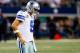 ARLINGTON, TX - DECEMBER 15: Quarterback Tony Romo #9 of the Dallas Cowboys walks off the field after losing 37-36 to the Green Bay Packers during a game at AT&T Stadium on December 15, 2013 in Arlington, Texas. (Photo by Tom Pennington/Getty Images)