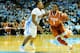 CHAPEL HILL, NC - DECEMBER 18: Nate Britt #0 of the North Carolina Tar Heels defends a drive by Isaiah Taylor #1 of the Texas Longhorns during their game at the Dean Smith Center on December 18, 2013 in Chapel Hill, North Carolina. (Photo by Grant Halverson/Getty Images)