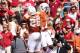 Oct 12, 2013; Dallas, TX, USA; Texas Longhorns receiver Mike Davis (1) celebrates a third quarter touchdown with running back Malcolm Brown (28) against the Oklahoma Sooners during the Red River Rivalry at the Cotton Bowl Stadium. Mandatory Credit: Matthew Emmons-USA TODAY Sports
