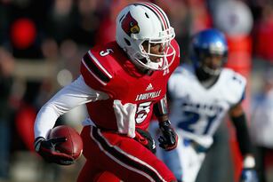 Hi-res-451609177-teddy-bridgewater-of-the-louisville-cardinals-runs-with_crop_north