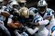 NEW ORLEANS, LA - DECEMBER 08: Pierre Thomas #23 of the New Orleans Saints is tackled by the Carolina Panthers defense at Mercedes-Benz Superdome on December 8, 2013 in New Orleans, Louisiana. (Photo by Chris Graythen/Getty Images)