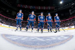 Hi-res-141590209-the-starting-lineup-for-the-edmonton-oilers-stands-for_crop_north