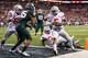 INDIANAPOLIS, IN - DECEMBER 07: Quarterback Braxton Miller #5 of the Ohio State Buckeyes rushes for a touchdown against the Michigan State Spartans in the third quarter of the Big Ten Conference Championship game at Lucas Oil Stadium on December 7, 2013 in Indianapolis, Indiana. (Photo by Andy Lyons/Getty Images)