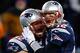 FOXBORO, MA - DECEMBER 08: Tom Brady #12 celebrates with teammate Ryan Wendell #62 of the New England Patriots following a touchdown late in the fourth quarter against the Cleveland Browns during the game at Gillette Stadium on December 8, 2013 in Foxboro, Massachusetts. (Photo by Jared Wickerham/Getty Images)