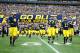 Nov 9, 2013; Ann Arbor, MI, USA; Michigan Wolverines offensive linesman Taylor Lewan (77) leads the team onto the field before the game against the Nebraska Cornhuskers at Michigan Stadium. Mandatory Credit: Rick Osentoski-USA TODAY Sports