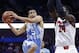 Nov 24, 2013; Uncasville, CT, USA; North Carolina Tar Heels guard Marcus Paige (5) shoots the ball around Louisville Cardinals forward Montrezl Harrell (24) during the second half at Mohegan Sun Arena. Mandatory Credit: Mark L. Baer-USA TODAY Sports