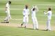 HAMILTON, NEW ZEALAND - DECEMBER 20: Peter Fulton of New Zealand walks off after being caught behind by Darren Sammy of the West Indies as Sunil Narine celebrates with Denesh Ramdin during day two of the Third Test match between New Zealand and the West Indies at Seddon Park on December 20, 2013 in Hamilton, New Zealand. (Photo by Hannah Johnston/Getty Images)