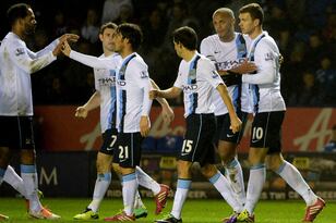 Hi-res-457414119-edin-dzeko-of-manchester-city-celebrates-with-team_crop_north