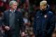 (FILE PHOTO - EDITORS NOTE: COMPOSITE OF TWO IMAGES - Image Numbers 177996036 (L) and 452339145) In this composite image a comparison has been made between Chelsea Manager Jose Mourinho (L) and Arsenal Manager Arsene Wenger. The Premier League match between Arsenal and Chelsea takes place on December 23, 2013 at the Emirates Stadium, London, England. ***LEFT IMAGE*** MANCHESTER, ENGLAND - AUGUST 26: Chelsea Manager Jose Mourinho looks on during the Barclays Premier League match between Manchester United and Chelsea at Old Trafford on August 26, 2013 in Manchester, England. (Photo by Alex Livesey/Getty Images) ***RIGHT IMAGE*** LONDON, ENGLAND - NOVEMBER 26: Manager Arsene Wenger of Arsenal looks on during the UEFA Champions League Group F match between Arsenal and Olympique de Marseille at Emirates Stadium on November 26, 2013 in London, England. (Photo by Shaun Botterill/Getty Images)