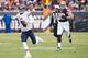 CLEVELAND, OH - DECEMBER 15: Outside linebacker Paul Kruger #99 of the Cleveland Browns chases quarterback Jay Cutler #6 of the Chicago Bears out of the pocket during the first half at FirstEnergy Stadium on December 15, 2013 in Cleveland, Ohio. (Photo by Jason Miller/Getty Images)