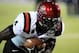 Nov 30, 2013; Las Vegas, NV, USA; San Diego State Aztecs running back Adam Muema (4) participates in warmups before an NCAA football game against the UNLV Rebels at Sam Boyd Stadium. Mandatory Credit: Stephen R. Sylvanie-USA TODAY Sports