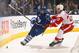 TORONTO, ON - DECEMBER 21: Nazem Kadri #43 of the Toronto Maple Leafs gets hit by Kyle Quincey #27 of the Detroit Red Wings during NHL action at the Air Canada Centre December 21, 2013 in Toronto, Ontario, Canada. (Photo by Abelimages/Getty Images)
